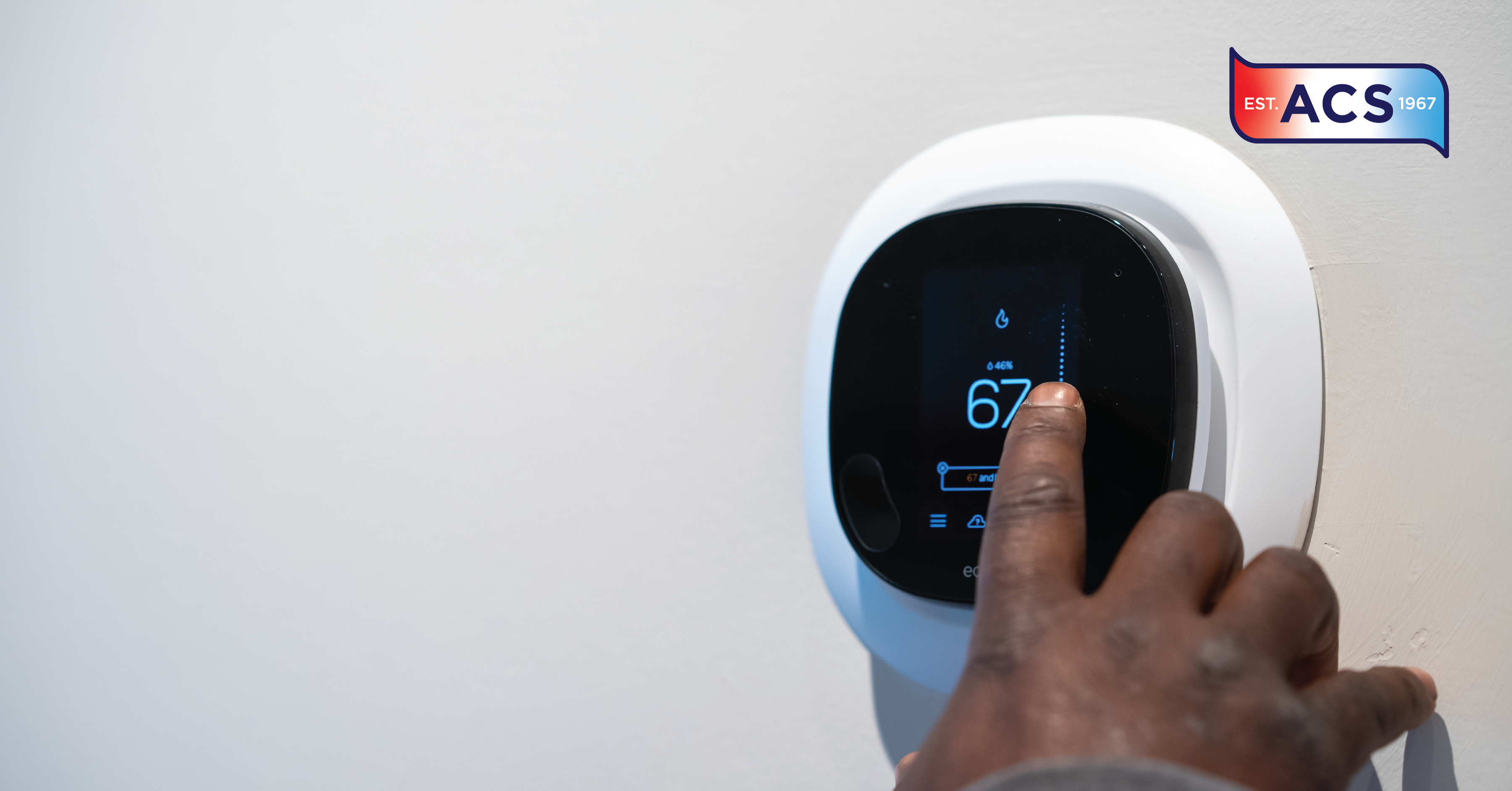 hand touching thermostat