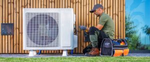 technician working heat pump