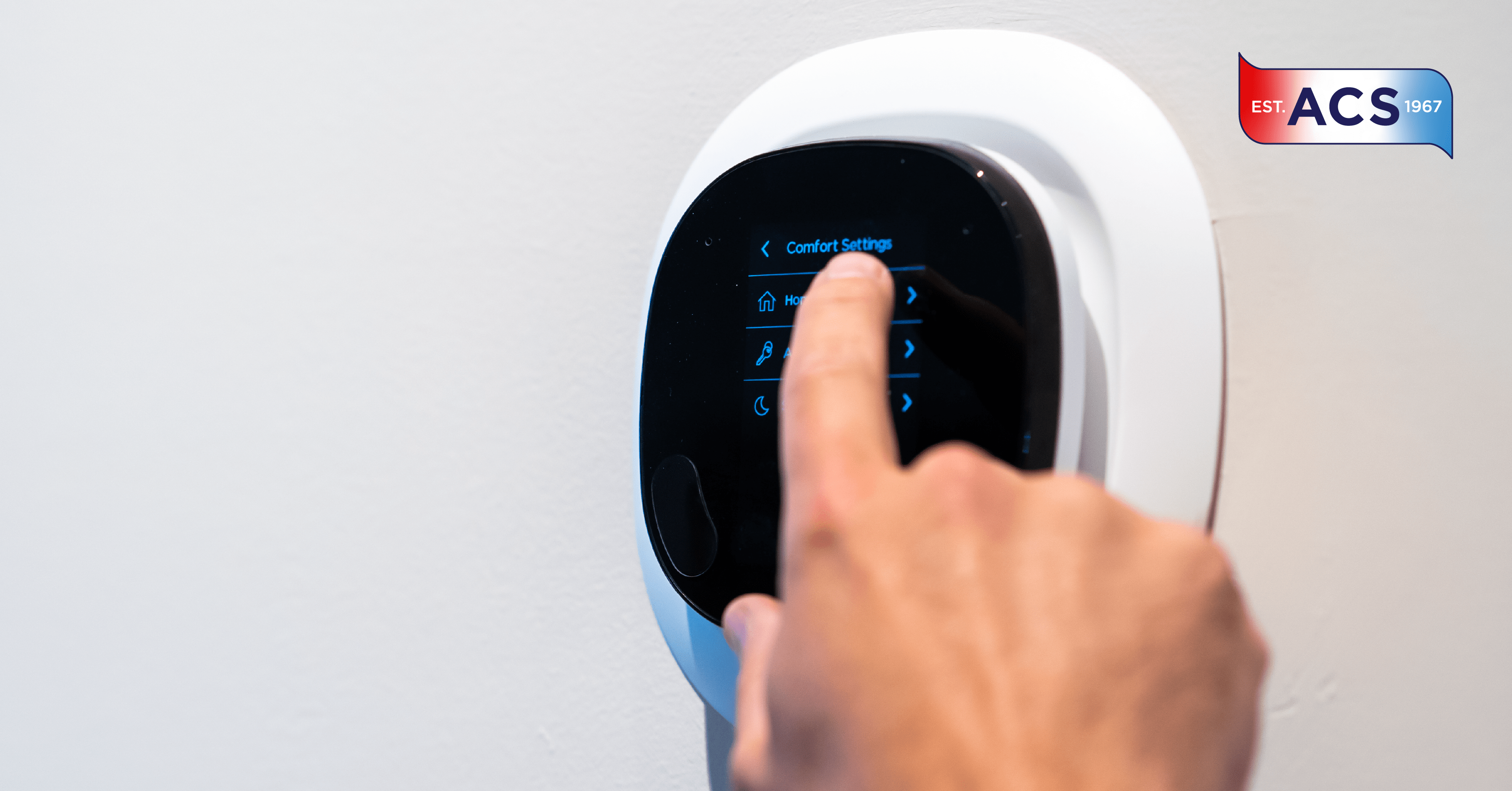 HVAC technician setting smart thermostat in home