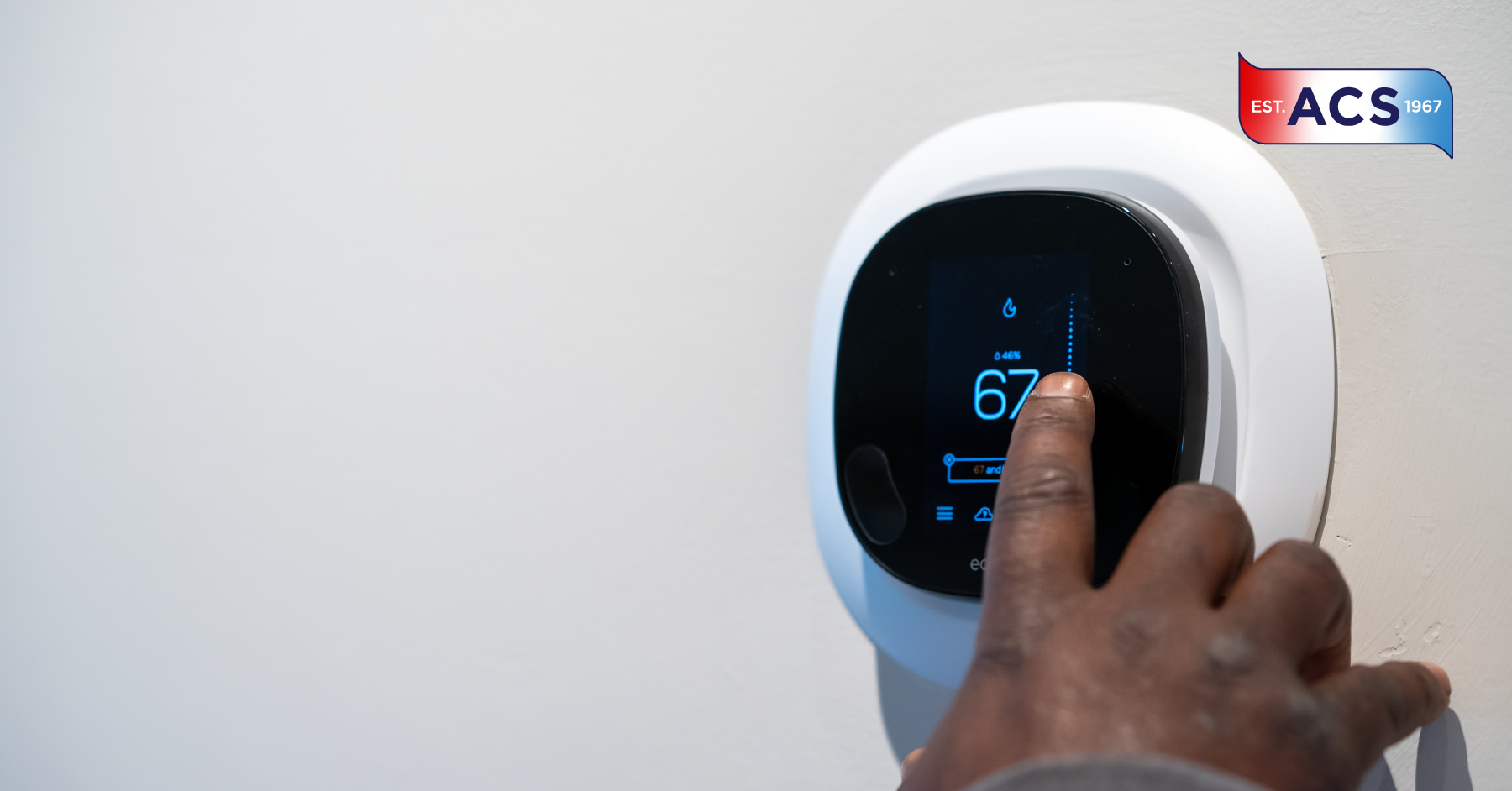 Person resetting smart thermostat in home