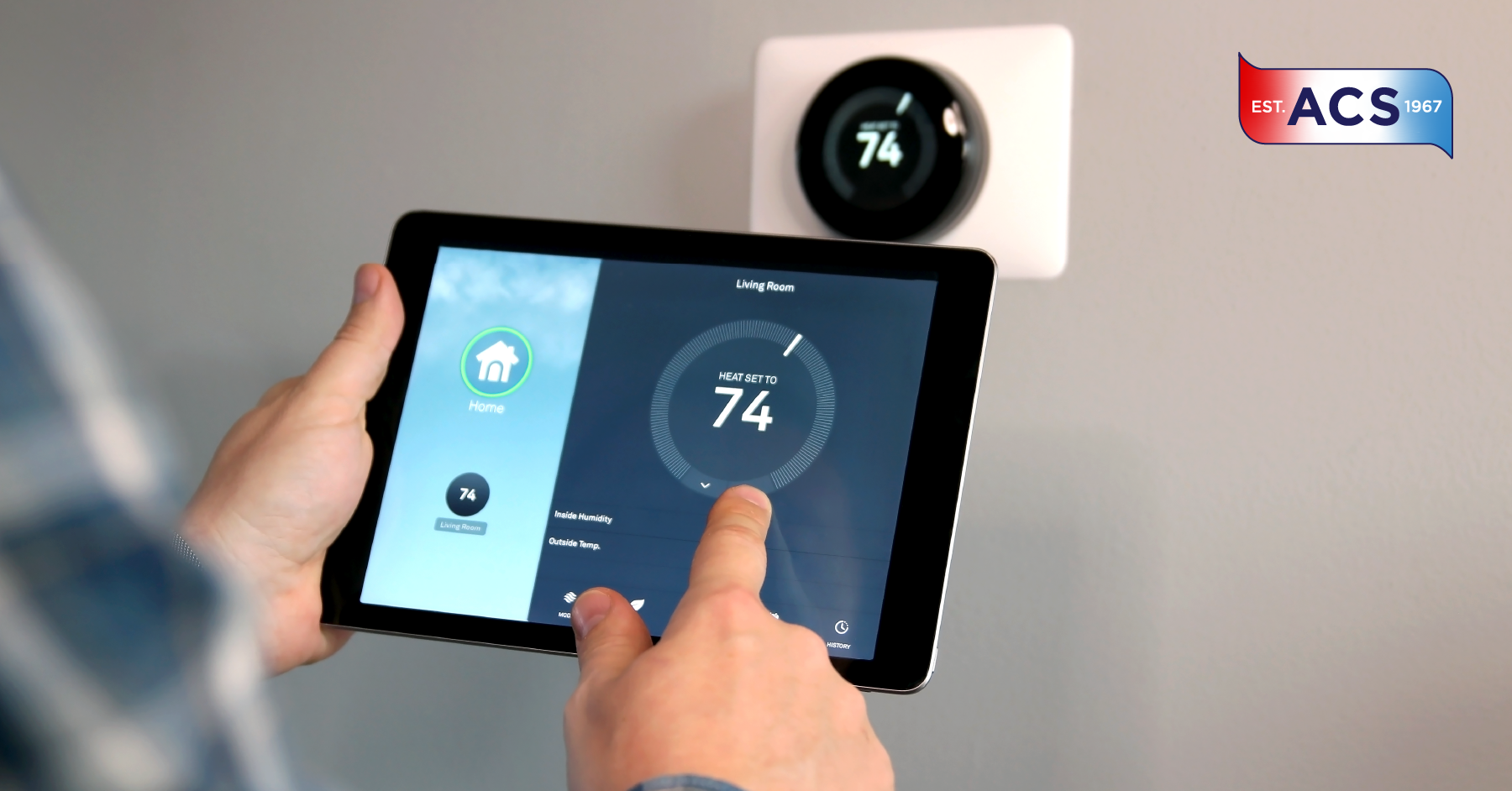 Homeowner resetting a smart thermostat in their home
