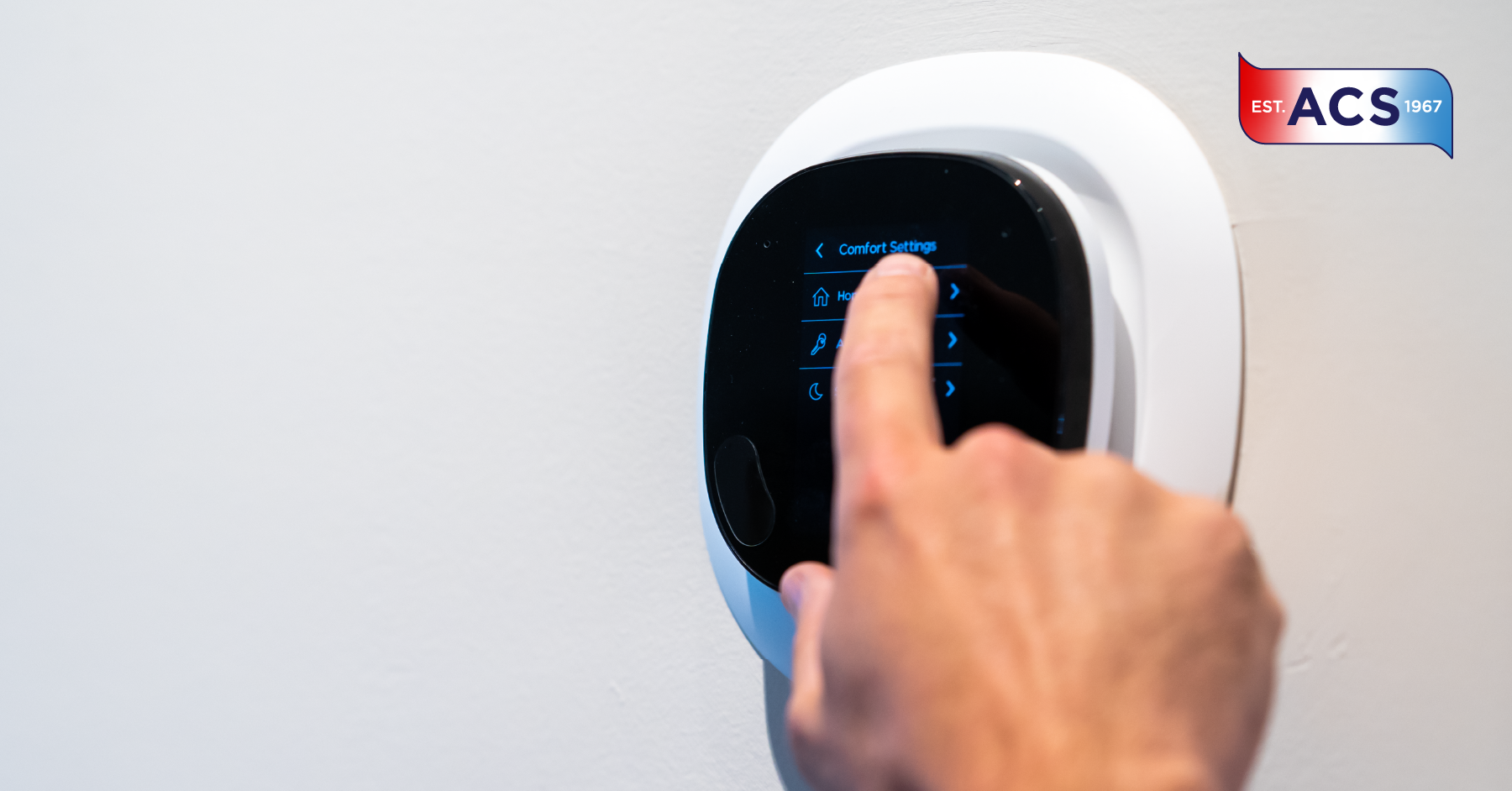 Person adjusting smart thermostat
