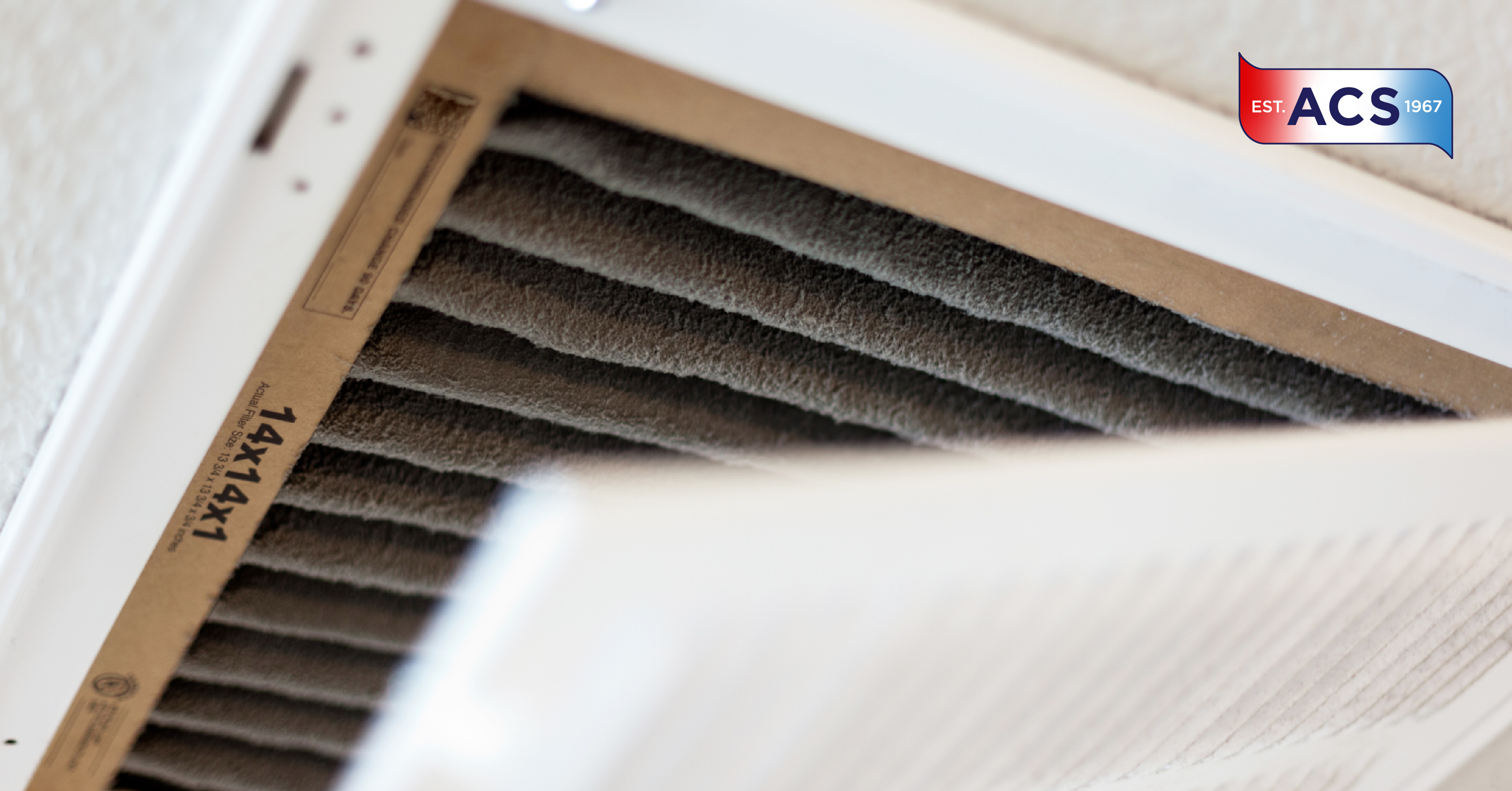 A person changing their home's dirty air filter