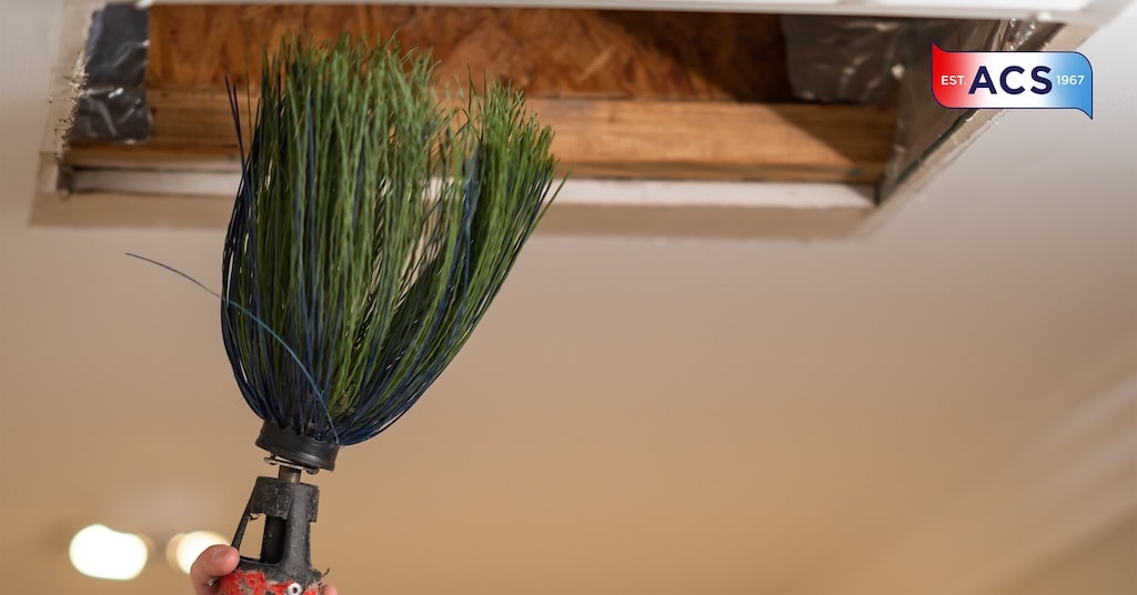 cleaning vents with green duster