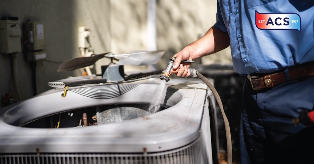 Man fixing heat pump