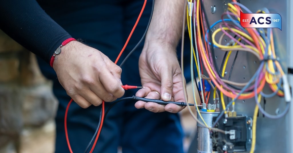 HVAC Technician working on the electrical wiring of an HVAC unit