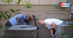 ACS HVAC technicians working on HVAC handler heat pump