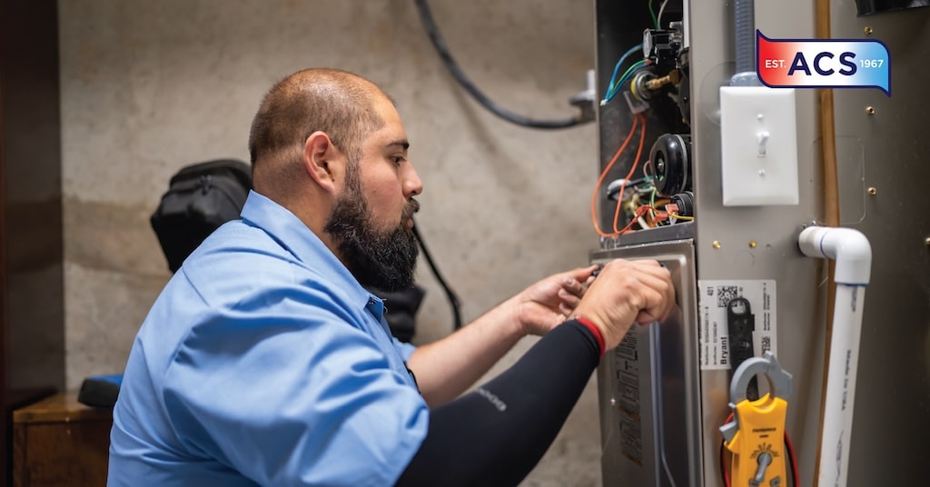 HVAC technician working on HVAC unit