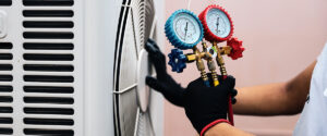 repairman checking air conditioner