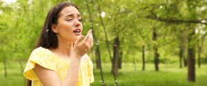 woman suffering from allergies during spring allergy season