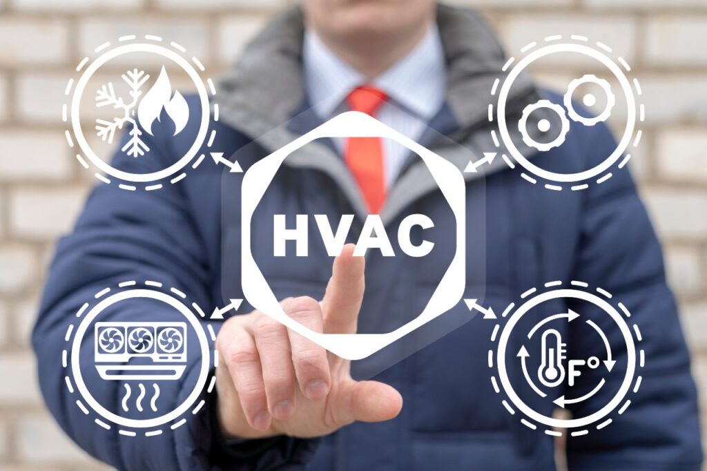 A person in a suit points to a virtual "HVAC" icon, surrounded by icons for heating, cooling, ventilation, and temperature control—highlighting professional HVAC Services in Athens.